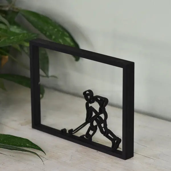 Sportieve decoratie: houten floating frame met hockeyer in actie