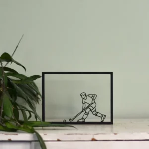 Houten floating frame met minimalistische lijntekening van een hockeyer