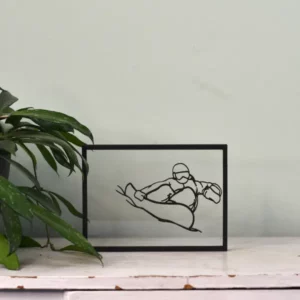 Houten floating frame met lijntekening van een snowboarder in de lucht